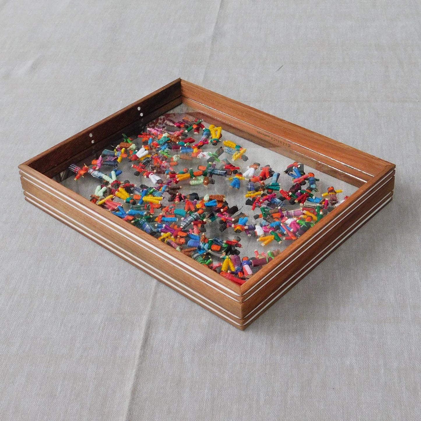 Bandeja con muñecas quitapenas