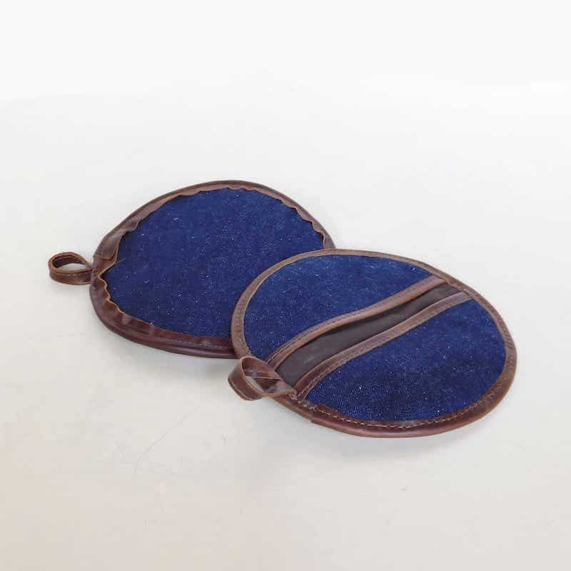 aislador redondo de lona con bordes de cuero