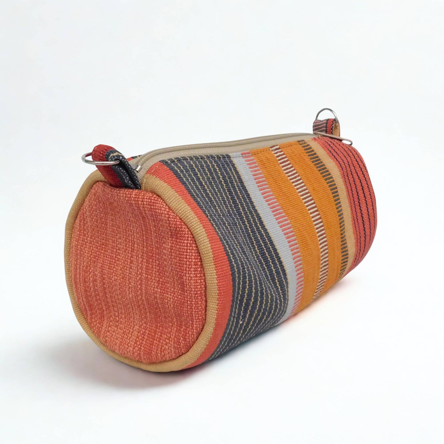 Bolso cilindro tonos calidos - Colección Raíces a rayas
